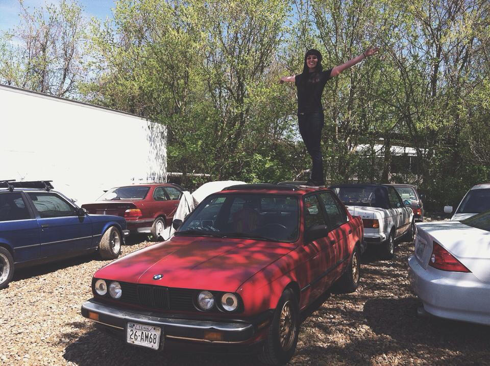 Working in a vintage BMW shop, standing on top of my 325e